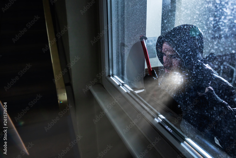 Burglar Looking Into A House Window