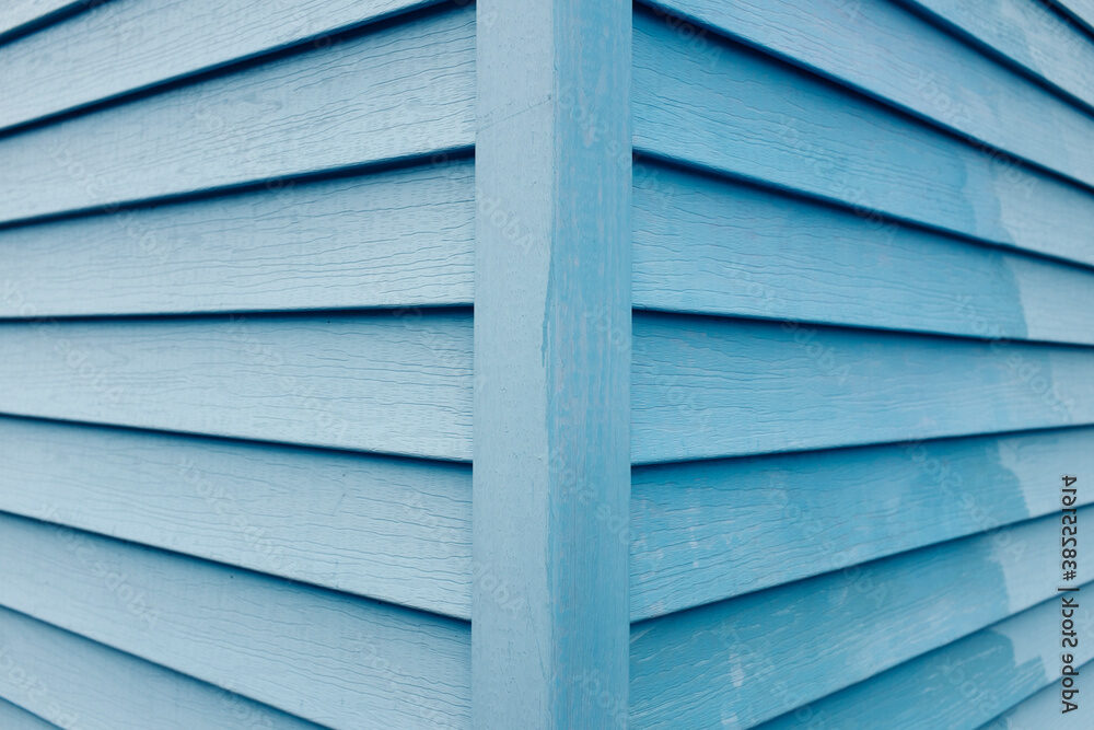 Detail of painted blue wall and building corner