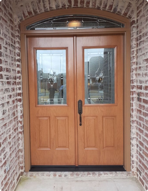 after - steel door with decorative glass and transom