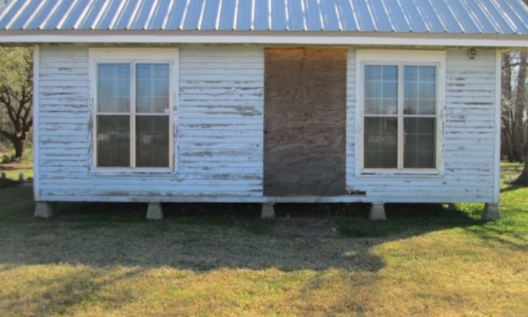 before - old worn down wood on white house