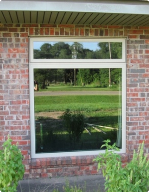 after - picture window with awning window brightens home