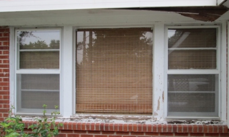 before - old, worn wooden window